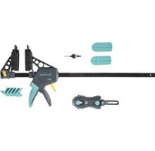 Jednoruční svěrka Wolfcraft se sadou příslušenství obsahující vrták, ochranné krytky a adaptéry.