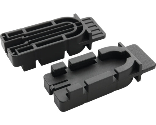 Dva černé plastové montážní prvky obdélníkového tvaru s drážkami a vodicími lištami pro montáž nábytku nebo oken.