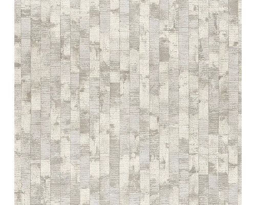 Vliesová tapeta s vertikálním vzorem nepravidelných obdélníků v dekoru kamene s jemnou strukturou.