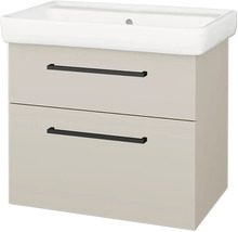 Béžová skříňka pod umyvadlo se dvěma zásuvkami, černými úchyty a bílým umyvadlem.