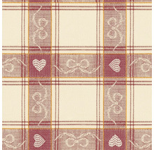 Detailní záběr látky s kostkovaným vzorem, motivem srdce a vzorem mašlí