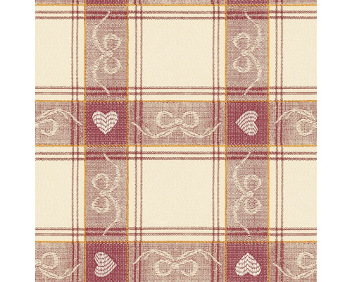 Detailní záběr látky s kostkovaným vzorem, motivem srdce a vzorem mašlí