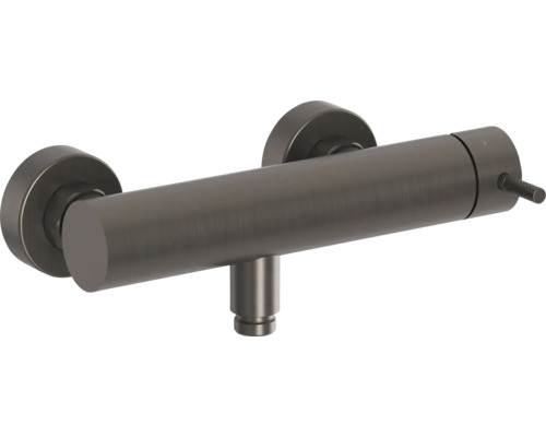 Sprchová baterie z kartáčovaného kovu pro nástěnnou montáž ve válcovém designu s pákovým ovládáním.