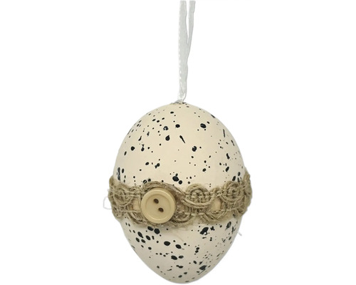 Dekorativní vajíčko s černými tečkami, jutovou stuhou a knoflíkem a poutkem na zavěšení pro velikonoční dekoraci.