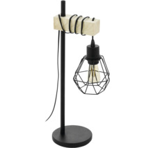 Industriální stolní lampa s černým kovovým podstavcem, dřevěným prvkem a černým drátěným stínidlem s viditelnou žárovkou.