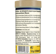 Zadní strana balení vločkového krmiva pro ryby Tetra TetraMin s informacemi o produktu, složením a čárovým kódem.