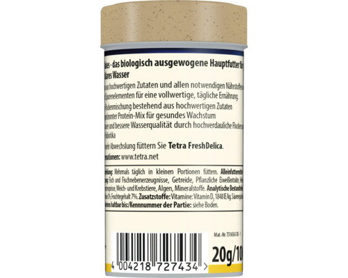 Zadní strana obalu krmiva pro ryby Tetra s informacemi o složení, krmení a čárovým kódem.