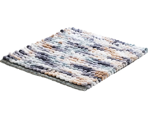 Koupelnová předložka s nopkovou strukturou a pruhovaným vzorem.