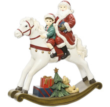 Vánoční dekorativní figurka Santa Clause a dítěte na bílém houpacím koni. Obsahuje vánoční stromek, dárky a medvídka na podstavci.