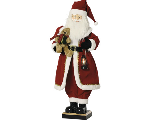 Vánoční figurka stojící Santa Claus s medvídkem a osvětlenou lucernou v červeném rouchu s bílým kožešinovým lemem.