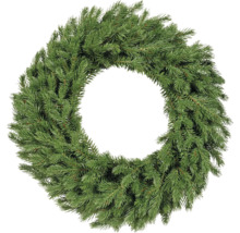Jedlový věnec ze zelených větví, kulatý a hustý, nezdobený adventní věnec.