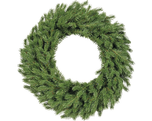 Jedlový věnec ze zelených větví, kulatý a hustý, nezdobený adventní věnec.