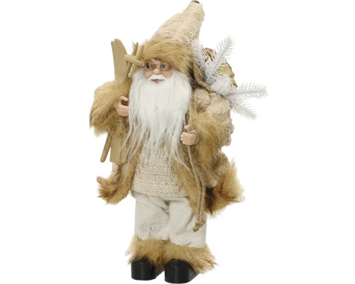 Vánoční dekorativní figurka Santa Clause s bílým plnovousem, kožichem, lyžemi a pytlem s jedlovými větvičkami.