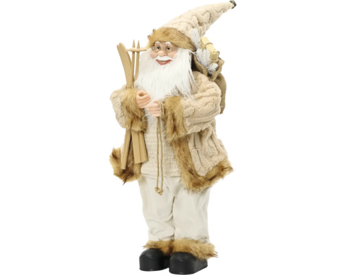 Dekorační figurka Santa Clause v béžovém pleteném kabátě s umělou kožešinou, drží dřevěné lyže a pytel s dárky.