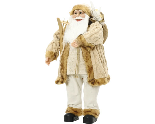 Figurka Santa Clause s lyžemi, jutovým pytlem a bílým vousem v béžovém plyšovém kabátě.