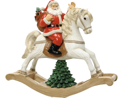 Vánoční figurka Santa Claus na bílém houpacím koni nad vánočním stromkem