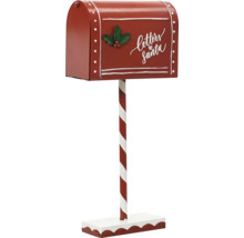 Červená vánoční poštovní schránka na pruhované tyči s nápisem Letters to Santa a ozdobou cesmíny.