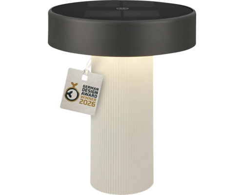 Válcová solární stolní lampa s bílou žebrovanou základnou a tmavou horní částí, pečeť German Design Award Winner 2026.
