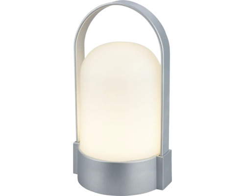 Přenosná LED stolní lampa s bílým plastovým difuzorem a stříbrným kovovým madlem.
