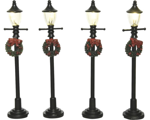 Sada čtyř černých miniaturních pouličních lamp s vánočním věncem a červenou mašlí.