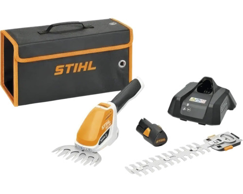 Sada akumulátorových nůžek na keře STIHL HSA 26 s nožem na trávu, nožem na keře, akumulátorem, nabíječkou a přepravní taškou.