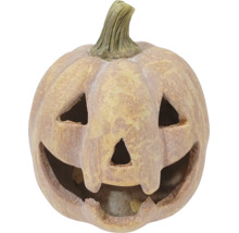 Dekorativní halloweenská dýně s vyřezávaným obličejem, strukturovaný povrch se vzhledem kamene.
