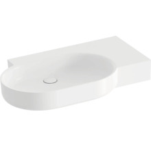 Bílé keramické umyvadlo na desku s asymetrickým tvarem a integrovanou odkládací plochou do koupelny