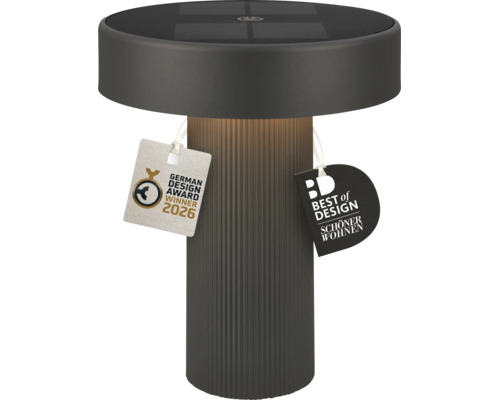 Moderní LED solární stolní lampa s žebrovanou základnou a solárním panelem na horní straně, včetně ocenění German Design Award 2026.