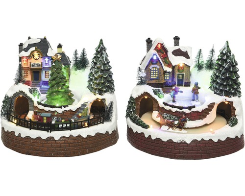 LED scenérie vánoční vesnička 18 x 16 x 19 cm Dekorativní vánoční krajina s nádražím, kluzištěm, vánočním stromkem a pohyblivým vlakem