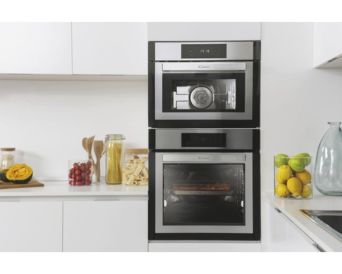 Vestavěná trouba a mikrovlnná trouba Candy v bílé kuchyni