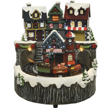 Dekorativní vánoční scéna s domy, nádražím a vlakem