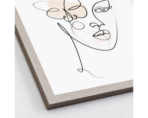 Zarámovaný obraz s abstraktním zobrazením ženy