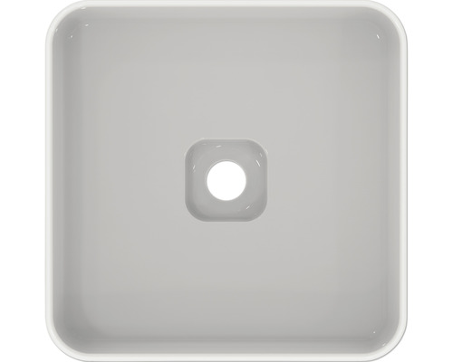 Pohled shora na čtvercové keramické umyvadlo na desku s odtokem