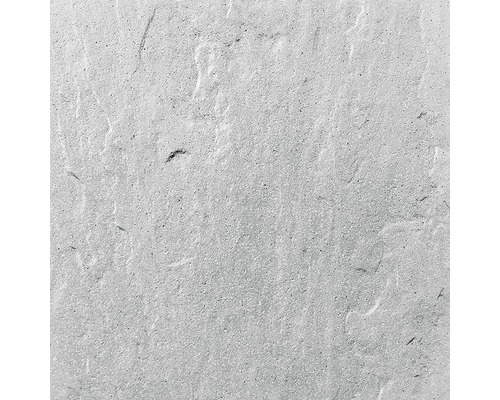 Detail světlé betonové desky s hrubou texturou.