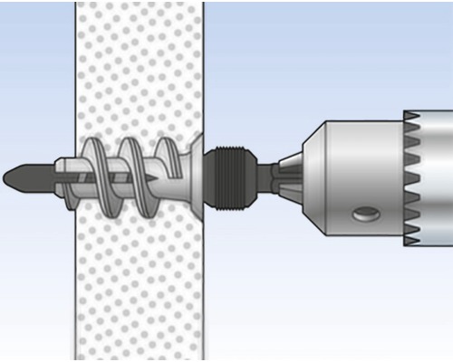 Vrtací stroj s hmoždinkou ve zdi
