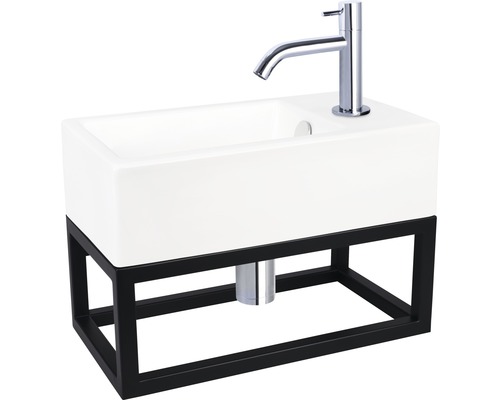 Umyvadlo s černým rámem a baterií