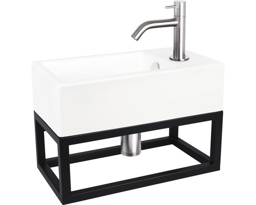 Umyvadlo s baterií a černým kovovým rámem