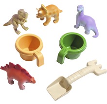 Sada hraček s figurkami dinosaurů, pohárky a lopatkou