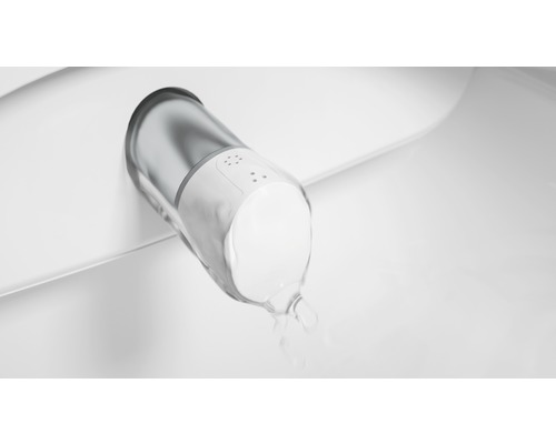 Obrázek sprchovacího WC v provozu s vodním paprskem.