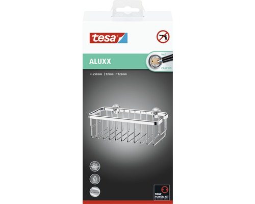 Sprchová polička Tesa Aluxx v krabici o rozměrech 250 x 92 x 125 milimetrů. Produkt je nerezový a vyrobený z hliníku.