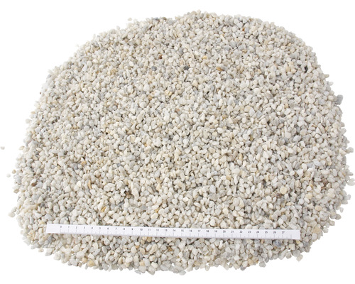 Dekorativní okrasné oblázky s měřicí stupnicí pro zobrazení velikosti.