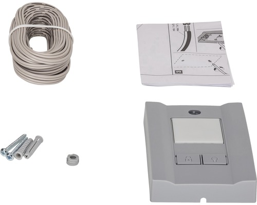 Komponenty pro pohon garážových vrat: kabel, návod, šrouby, hmoždinky a řídicí jednotka