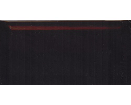 Obklad Metro Black 10x20cm Tmavý povrch s tenkým proužkem v horní části
