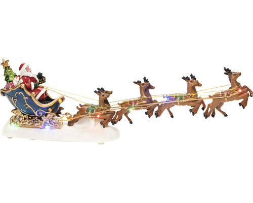 Dekorativní vánoční scéna se Santa Clausem v saních tažených soby