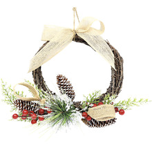 Dekorativní věnec na dveře s mašlí, šiškami a bobulemi pro slavnostní příležitosti