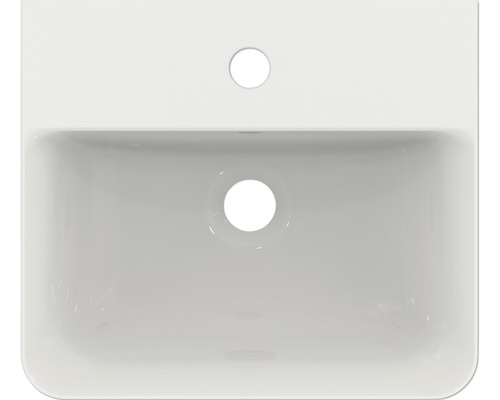 Pohled shora na umyvadlo ze sanitární keramiky s otvorem pro kohoutek