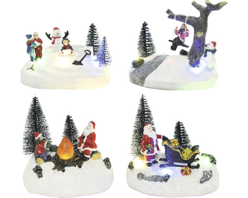 LED Scenérie, různé druhy Různé vánoční dekorace s figurkami a stromy na zasněženém podkladu.