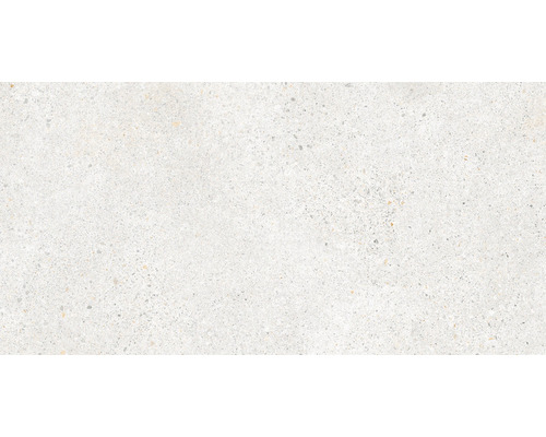 Detail světlé keramické dlaždice se vzhledem teraca