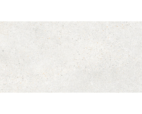 Detail světlé podlahové dlaždice s jemnou kresbou