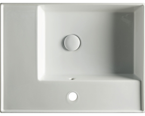 Pohled shora na obdélníkové keramické umyvadlo s přepadem